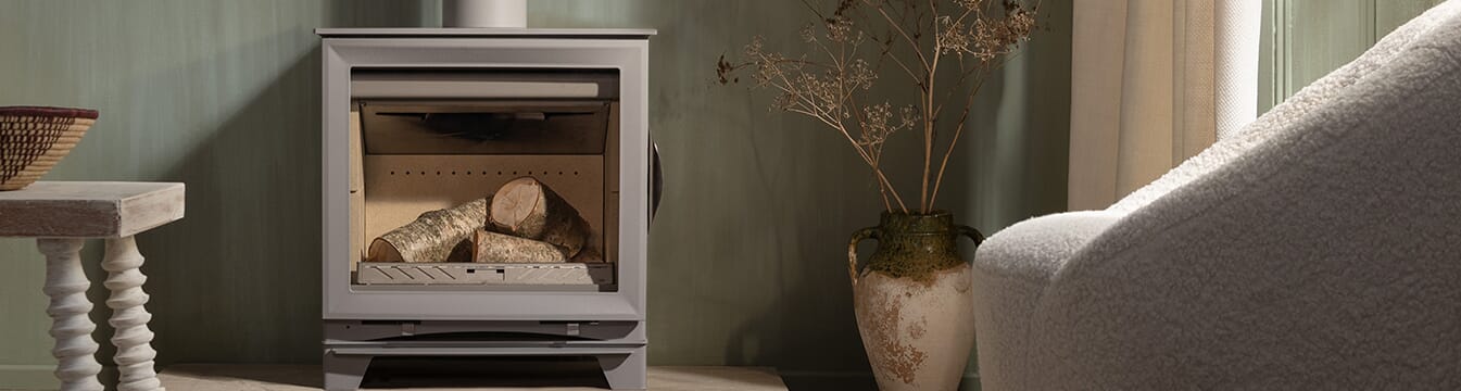 Arada M Series 5 Widescreen stove with cast iron door and shown in optional Pebble grey colourway